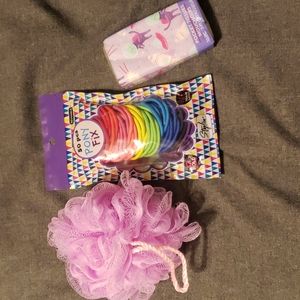 Colorful pony tail elastics, shower poof, tissues.